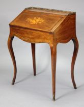 A 19th century French ladies bureau with marquetry decoration to the hinged fall-front enclosing a