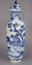 An 18th century Chinese blue & white porcelain tall ovoid vase & cover, decorated with numerous