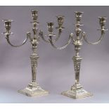 A PAIR OF EDWARDIAN SILVER TABLE CANDELABRA in the Neo-Classical style, each with square tapered