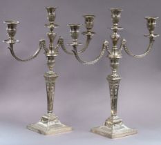 A PAIR OF EDWARDIAN SILVER TABLE CANDELABRA in the Neo-Classical style, each with square tapered