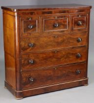 An early Victorian figured mahogany chest in two sections, fitted three short & three long ash-lined