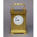 A gilt-brass carriage timepiece with blue Arabic numerals to the 4.5cm circular enamel dial, 10.