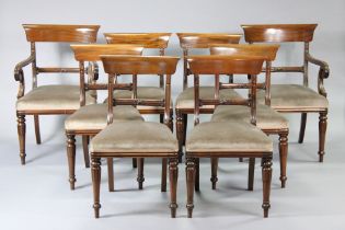 A set of eight William IV mahogany bow-back dining chairs with padded seats & carved, & turned