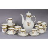 A Royal Copenhagen “Golden Basket” pattern 26 piece coffee service with gilt decoration on a white