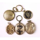 Five various 19th century engraved gilt-metal pendant lockets (one lacking cover to one side).