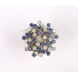 An 18k ring set cluster of numerous small blue & white sapphires; size: M/N; 8.6gm.