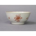 An 18th century Chinese export porcelain bowl painted with iron-red flower sprays on a white ground,