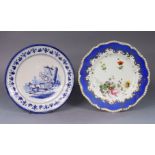 An 18th century Dutch delft 22cm dia plater painted in blue with figures in a cart, in banded &