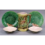 A pair of Minton-type majolica shell-shaped dishes with cranes, 21cm; & a pair of leaf-moulded green