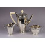 A George V silver three-piece coffee service with panelled sides & rope-twist borders, the coffee