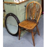 A wheel-back kitchen chair with a hard seat, & on turned legs with spindle stretchers; together with