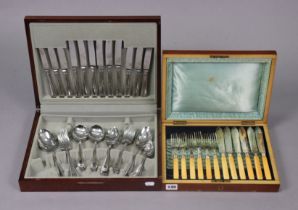 A set of six silver plated dinner knives & forks with bone handles; & in a mahogany case; & a part