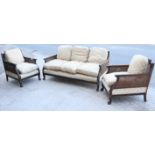 A beech frame three-piece lounge suite in the 19th century continental style comprising a three-