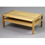 A light oak rectangular two-tier low coffee table on four short square legs, 103.5cm wide x 40.5cm