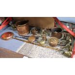 A copper warming pan with a long turned wooden handle; a copper coal scuttle; a pair of brass