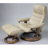 A Stressless Opal Promotion Batick Hole leatherette swivel & reclining armchair & footstool (