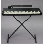 A Yamaha “YPR-7” electric keyboard with stand.