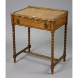 A 1930’s small oak side table fitted with a frieze drawer & on bobbin-turned legs & turned feet with