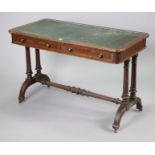 A Victorian mahogany writing table inset green leatherette fitted two frieze drawers, & on two pairs