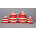 A pair of T.G. Green & Co. storage jars with red & white bands, 16.5cm high; & a ditto smaller pair,