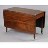 A 19th century mahogany drop-leaf dining table on four turned legs with ceramic castors 117cm x