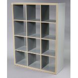 A contemporary grey-finish standing open bookcase of twelve divisions, 112cm wide x 147cm high x
