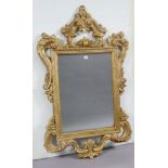 Another 19th century-style large gilt frame wall mirror with a pierced scroll border, 135cm x 81cm.