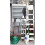 Two aluminium step ladders; an electric lawn mower; & various garden tools.