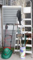 Two aluminium step ladders; an electric lawn mower; & various garden tools.
