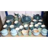 A set of four Le Creuset turquoise glazed two-handled soup bowls; a ditto heart-shaped bowl; &