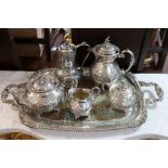 A silver plated four-piece tea & coffee service with embossed foliate design; two similar tea-trays;