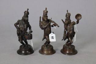 A set of three French mid-20th century bronzed novelty dog character musician figures, 29cm (