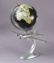 A 1960’s/1970’s Legend 22cm diameter globe on a novelty silvered-metal aeroplane base, 47cm high.