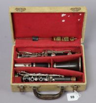 A vintage ebonised clarinet by J.R. Lafleur & Son Ltd. of London with nickel plated keys, 67cm long,