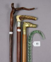 A 19th century green tinted glass walking cane of spiral-twist design, 99cm high (w.a.f); together