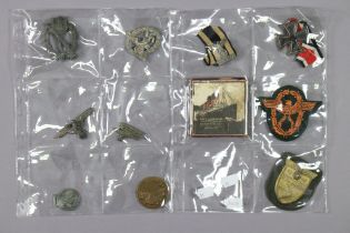 A WWII German Infantry Assault badge; a ditto Luftwaffe pilot's badge; eight various other German