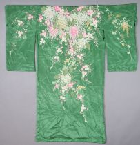An early/mid-20th century Japanese green silk kimono with all-over multi-coloured embroidered floral