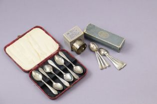 A set of six George VI silver tea spoons, Sheffield 1944; a set of six George V silver coffee