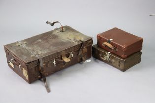 A vintage simulated crocodile skin suitcase, 71.5cm wide; & four small suitcases.