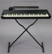 A Yamaha “YPR-7” electric keyboard with stand.