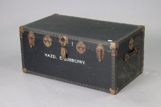 A mid-20th century black fibre-covered travelling trunk with a hinged lift-lid, 92cm wide x 41.5cm