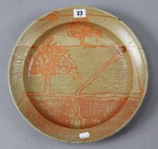 A Studio pottery large shallow bowl of fawn glaze & with orange tree decoration, 35cm diameter.