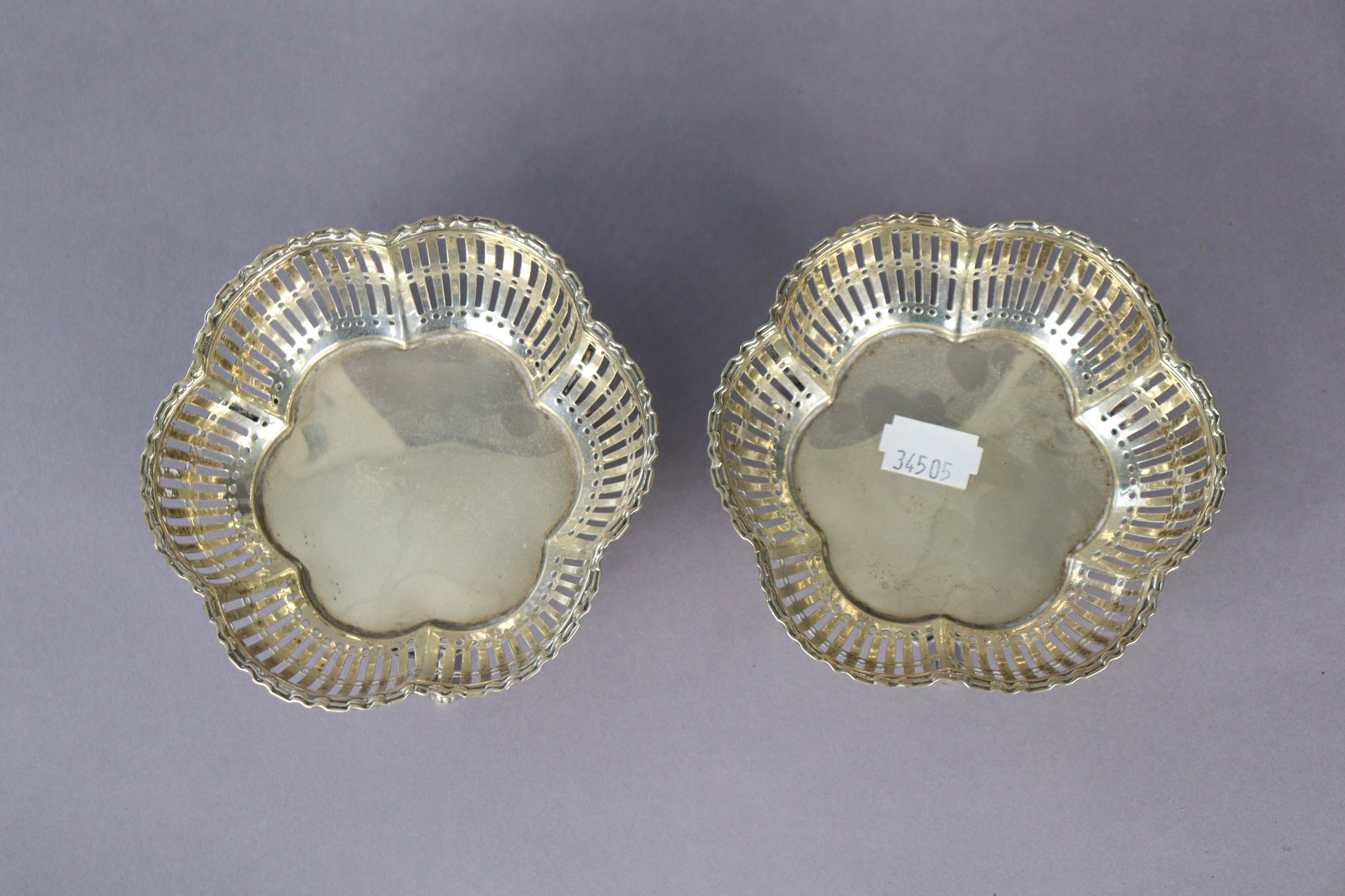 A pair of George V silver sweetmeat dishes each with a pierced border & on three slender legs, - Image 2 of 4