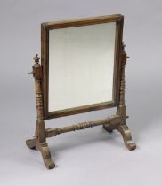 A 19th century mahogany rectangular campaign dressing table mirror on turned supports & cabriole