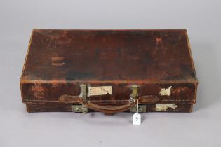 A vintage Revelation tan-leather expanding suitcase with chrome twin-lever locks, 70.5cm wide;
