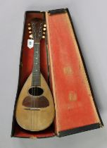 An Italian mandolin, 60cm long, bears paper label, “Raffaele Marateo, Napoli”, with case.