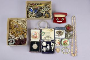 A silver engraved hinged bracelet; three sporting medals; & various items of costume jewellery.