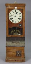 A vintage National time recorder clock in an oak case 34.5cm wide x 98.5cm high.