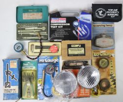 Various vintage car accessories including lamps, gauges, etc., boxed & unboxed.