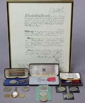 The MBE Badge in silver, with ribbon, cased; the Civil Defence Long Service Medal, cased; an